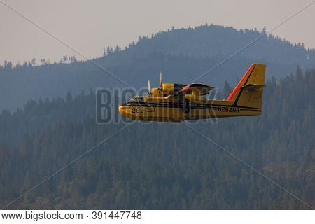 Lost Creek Lake Near Prospect,  Oregon / Usa - September 7, 2014:  A Small Fire Fighting Plane Prepa