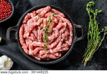 Raw Ground Pork. Organic Minced Meat, Forcemeat. Black Background. Top View