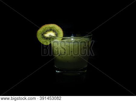 Kiwi Cocktail Smoothie In Glass On Black Background
