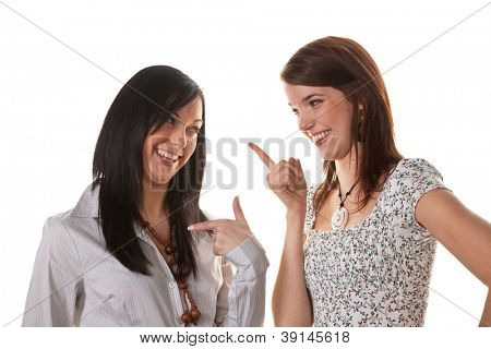 two young girls whispering to the latest news