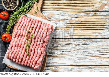 Raw Minced Pork On A Chopping Board. Organic Ground Meat, Forcemeat. White Background. Top View. Cop