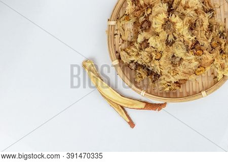 Sliced Licorice Roots And Dried Chinese Chrysanthemum Flower