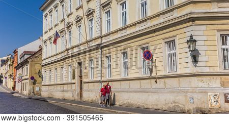 Litomerice, Czech Republic - September 12, 2020: Couple Walking A Cobblestoned Street In Litomerice,