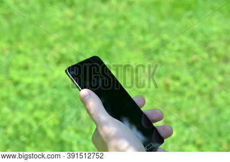 Kiev, Ukraine - June 8, 2016: Smartphone Xiaomi Mi 5 In Male Hand. Chinese Electronics Company Xiaom