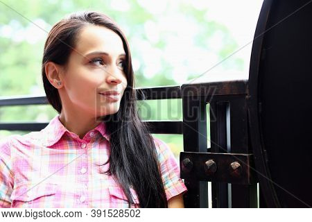 Portrait Of Brunette Woman Sitting On Summer Veranda And Dreamily Looking Into Distance. Positive Af