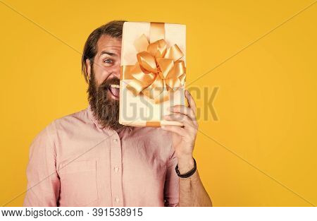 Surprised Male Open Cardboard Box With Something Exciting Inside. Mature Man Looking Casual In Surpr
