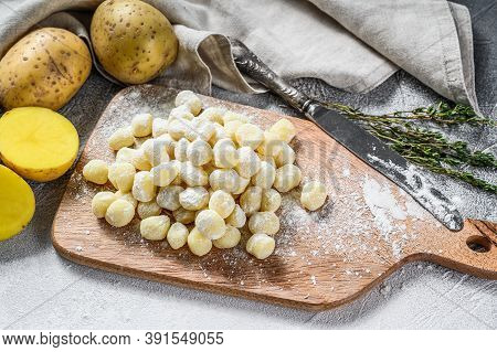Handmade Gnocchi Di Patata, Traditional Italian Pasta Ready For Cooking. Gray Background. Top View