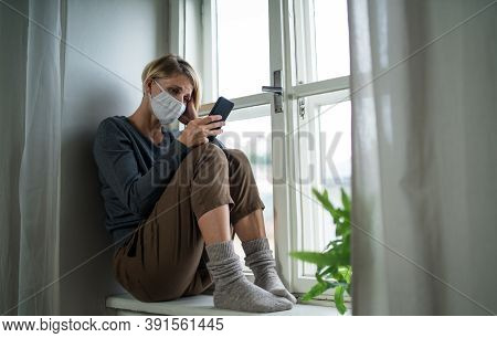 Stressed Woman With Smartphone Indoors At Home, Mental Health And Coronavirus Concept.