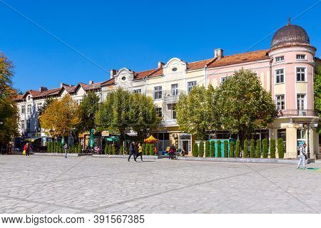 Razlog, Bulgaria - October 20, 2020: Downtown Street Square Panoramic View With Autumn Trees And Peo