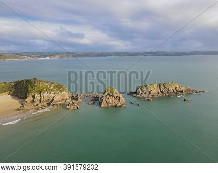 Monkstone Ridge Surrounded By A Turquoise Ocean On A Cloudy Day
