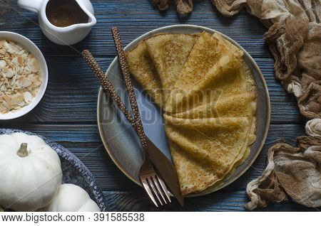 Pumpkin Pancakes With Date Syrup And Almonds