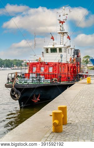 Fireboat Or Firefighter Ship Equipped With Multiple Water Cannons And Extinguishers. Anchored On Ram