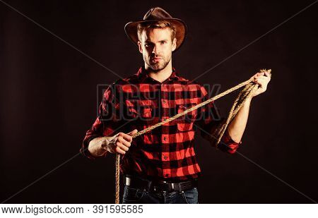 In Texas. Wild West Rodeo. Man In Hat Black Background. Western Cowboy Portrait. Vintage Style Man. 