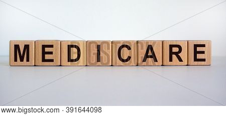 Wooden Cubes With Word 'medicare'. Beautiful White Background. Medical Concept. Copy Space.