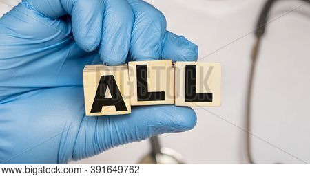 All Acute Lymphoblastic Leukemia - Word From Wooden Blocks With Letters Holding By A Doctors Hands I