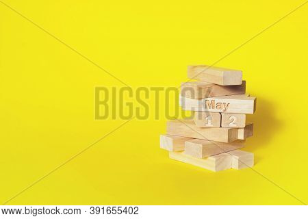 May 12nd. Day 12 Of Month, Calendar Date. Wooden Blocks Folded Into The Tower With Month And Day On 