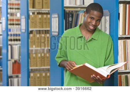 Man In Library Holding Book (Depth Of Field)