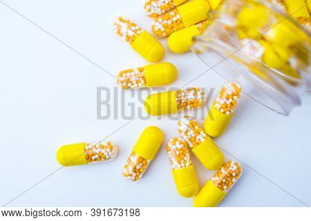 Open Container With Vitamin D3 Capsules Isolated On White Background