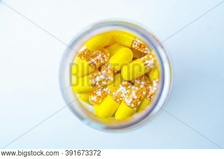 Open Container With Vitamin D3 Capsules Isolated On White Background