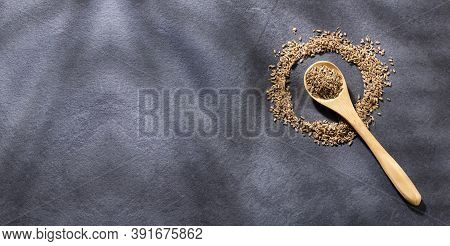 Dried Anise Seeds In Wooden Spoon - Pimpinella Anisum