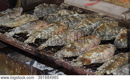 Roast Anabas Is On The Stove, Using Charcoal To Cook.