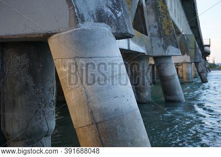 View Of Abandoned Harbour Bridge Piles At Sunset. Ahuriri, Napier.