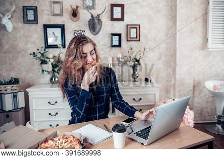 Busy Businesswoman Work At Home While Working On Table Desk With Laptop At The Same Time She Eating,