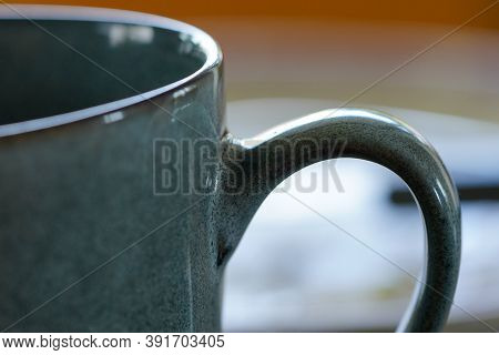 Close Up Shot Of Blue Coffee Or Tea Mug In Morning Light