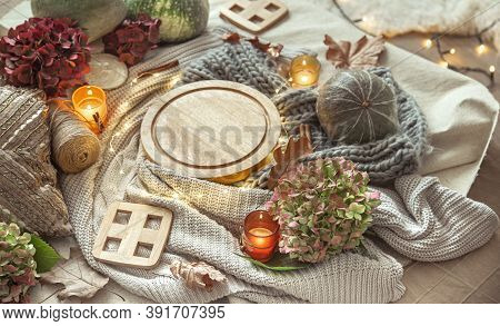 Autumn Composition Of Details Of Home Decor And Comfort With Candles And A Gerland.