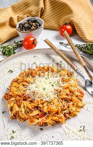 Bolognese Pasta, Risone With Ground Beef. White Background. Top View.