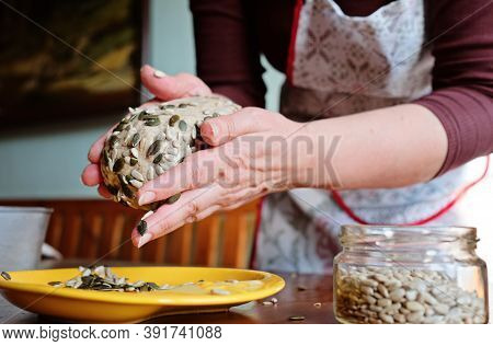 Housewife Hands Making Dough For Bread Crumbles In Sunflower And Pumpkin Seeds