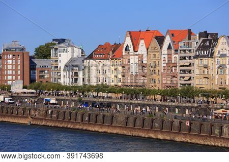 Dusseldorf, Germany - September 19, 2020: People Visit River Rhine Waterfront In Dusseldorf, Germany