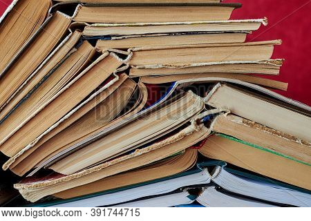 Old Books Piled Up In A Heap, Close-up, Learning And Education Concept.