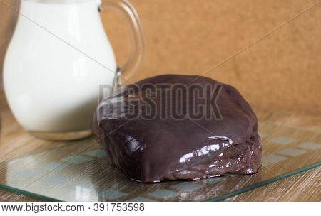 Raw Pieces Of Liver On Glass Cutboard The Jar With Milk