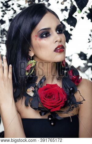 Pretty Brunette Woman With Rose Jewelry, Black And Red, Bright Make Up Kike A Vampire Closeup Red Li
