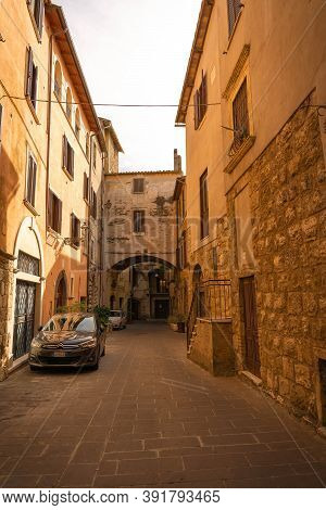 Modern Cars On Street Of  Medieval Town Of Orte In Italy.