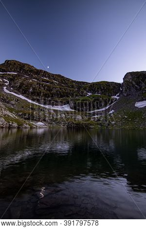 Moon Over The Lake At Dusk On A Clear Summer Night, Switzerland