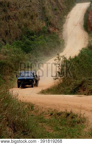 Itamaraju, Bahia / Brazil - August 6, 2008: Vehicle Travels On A Dirt Road That Connects The Municip