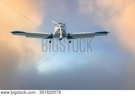 Landing Airplane At The German North Sea Island Helgoland. Colorful Sky