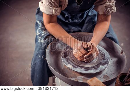 Ceramist Master Making Ceramic Pot On The Pottery Wheel . Close-up.