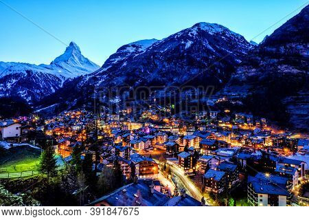 Beautiful View Of Old Village In Twilight Time With Matterhorn Peak Background In Zermatt, Switzerla