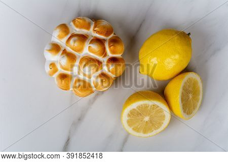 Fresh Lemon Pie With Meringue And Lemon Citrus Fruit.