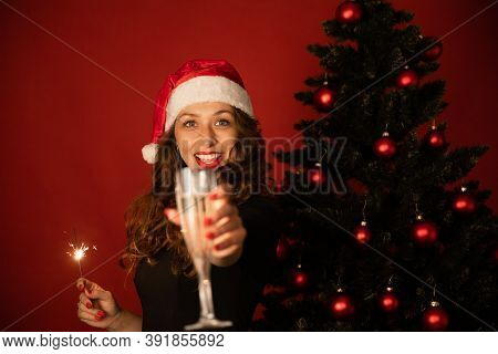 Beautiful Long-hair Brunette Girl In Santa Claus Hat Distant Celebrates New Year With Loved Ones Onl