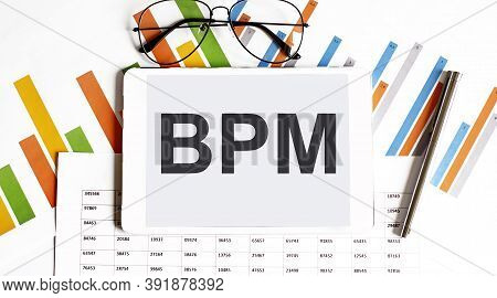 The Tablet With Bpm On Chart With Pen And Glasses