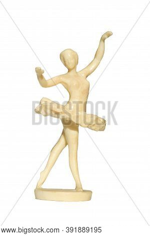 Figurine Of A Ballerina Girl Isolated On White. Porcelain Statuette Of Dancing Ballerina