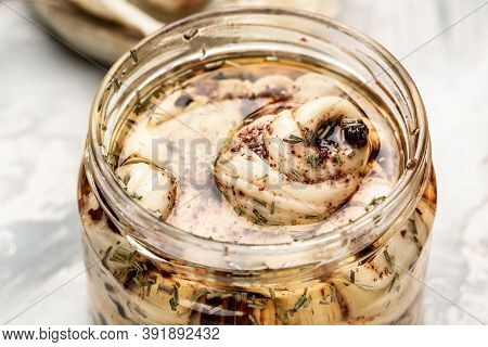 Iraqi Traditional Cheese Made From Buffalo Milk. Cheese In Marinade With Olive Oil, Chili And Basil,