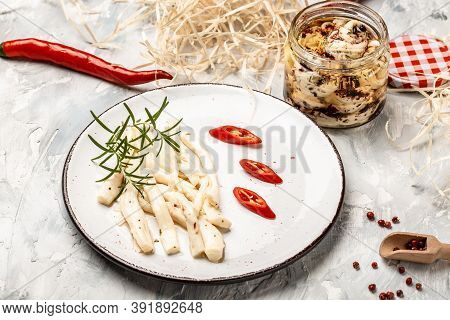 Iraqi Traditional Cheese Made From Buffalo Milk. Cheese In Marinade With Olive Oil, Chili And Basil,