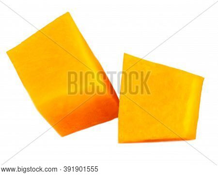 Diced Pumpkin  Isolated On White Background.  Fresh Pumpkin Pieces Cut In A Cube Slice, Top View. Fl