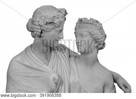 Ancient sculpture of Bacchus and Ariadne. Marble man and woman statue isolated on white background.