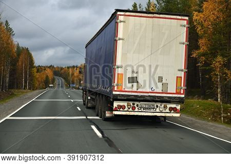 Karelia, Russia - September 30, 2020: Truck Goes Along The Highway Through The Autumn Forest, Trucki